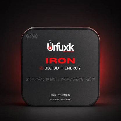 Iron oral strip tin on a dark studio background